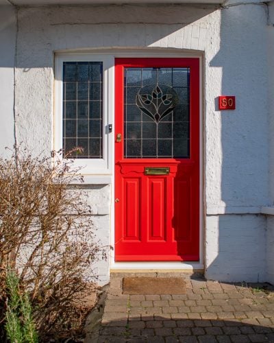 Late Edwardian red front door and sidelight frame. Door painted bright red. Stained glass in door and frame