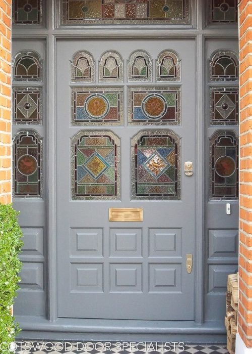 Ornate Victorian front door and frame with stained glass