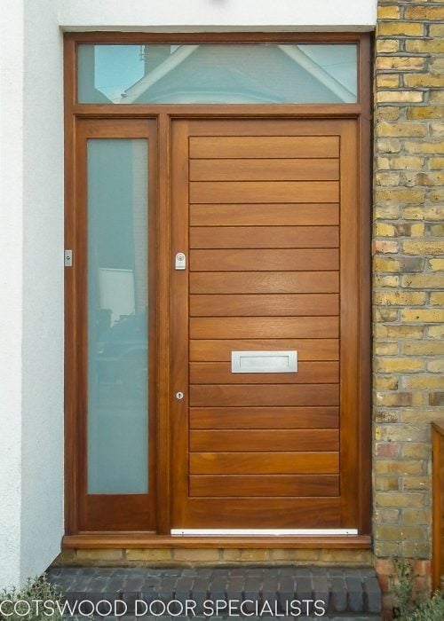 Dark wood contemporary front door and sidelight frame. Satin chrome door furniture. Etched glass