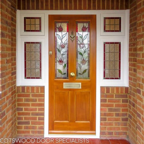 Victorian stained accoya door and sidelight window frame. Door light oak in colour. Door fitted with security multipoint lock. Antique brass door furniture, Opening side windows. Stained glass leaded double glazed units