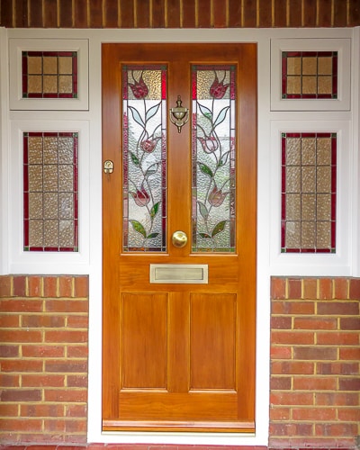 Victorian stained accoya door and sidelight window frame. Door light oak in colour. Door fitted with security multipoint lock. Antique brass door furniture, Opening side windows. Stained glass leaded double glazed units