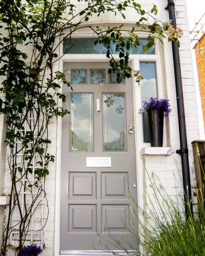 Light grey Edwardian 5 light front door with sandblasted glass. Door fitted into new white painted wooden door frame. All glass sandblasted and double glazed. Edwardian sidelight door frame with transom