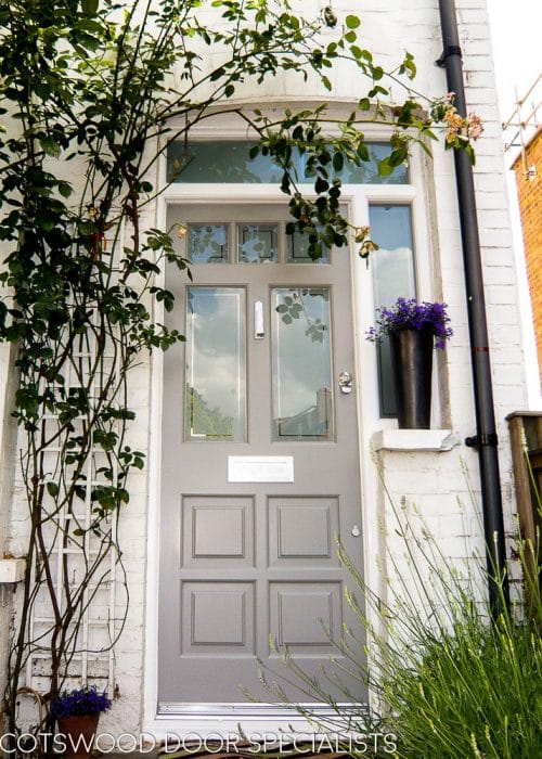 Light grey Edwardian 5 light front door with sandblasted glass. Door fitted into new white painted wooden door frame. All glass sandblasted and double glazed. Edwardian sidelight door frame with transom
