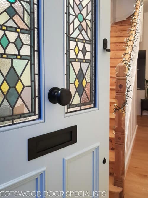 Closeup showing the stained glass in the Victorian from door. Beautiful steel blue colour
