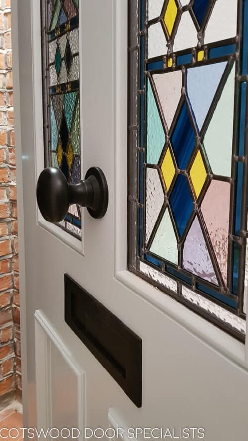 Closeup showing the stained glass in the Victorian from door. Beautiful steel blue colour