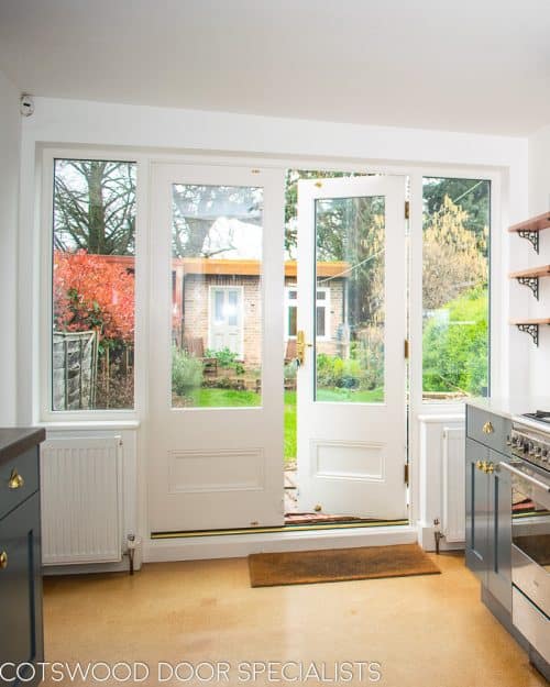 Victorian glazed french doors. French doors with clear double glazed glass. Sidelights have triple glazing with just over half glass. All painted in satin off white