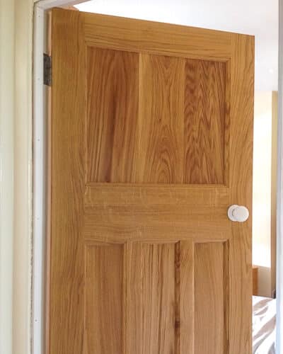European Oak 1930s internal door. Solid oak door with beautiful grain showing. White porcelain door knob