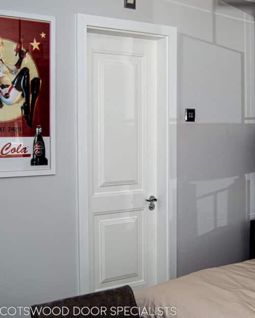 En Suite Contemporary door. White painted bespoke internal door to ensuite with polished chrome door furniture