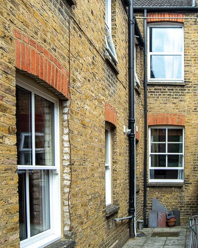 Victorian sash windows. A series of double glazed wooden sash windows fitted into a London home. White painted windows