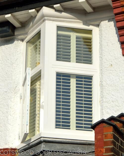 Oriel casement window. White wooden double glazed oriel window fitted into an Edwardian London home. Clear glass and white painted wood.